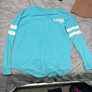 Hi! i’m selling a bright blue aruba shirt. it’s super cute